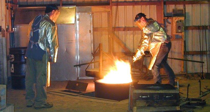 The author of this blog (left) and his brother (right) melt brass in preparation for pouring into molds.