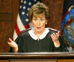 Judge Judy arbitrating over small claims.