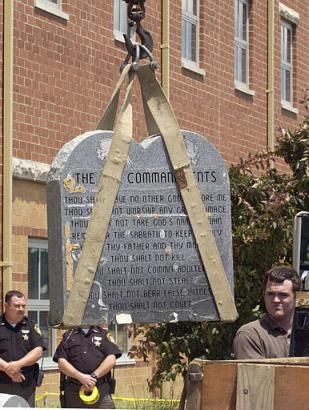 A Ten Commandments monument is removed from a school in West Union, Ohio, in June 2003.